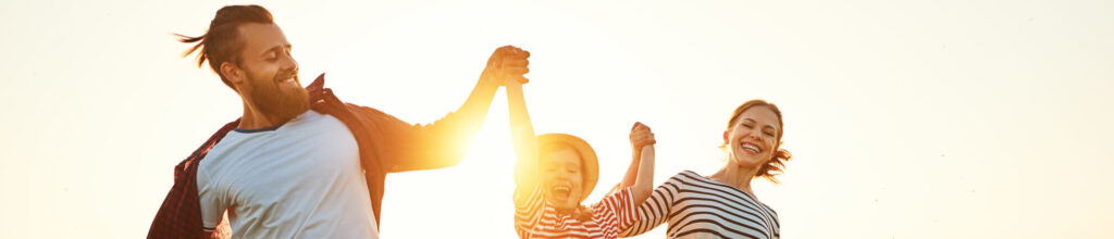 Happy family: mother, father, children son and daughter on sunset