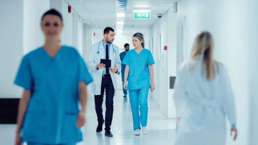 Surgeon and Female Doctor Walk
