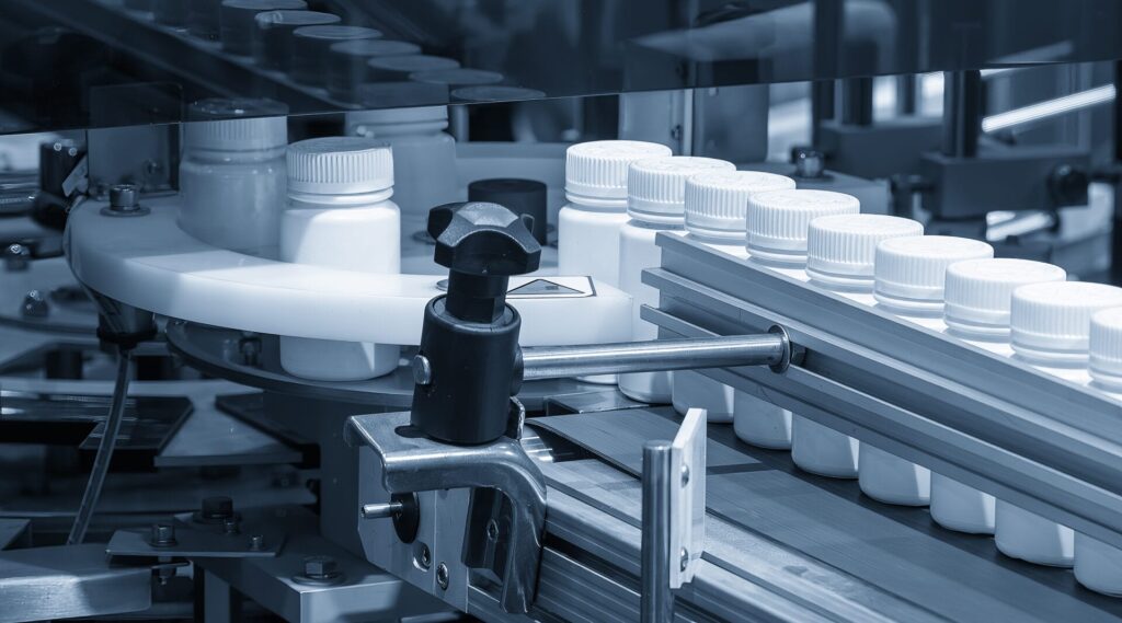 Medicine bottle filling process in the light blue scene.