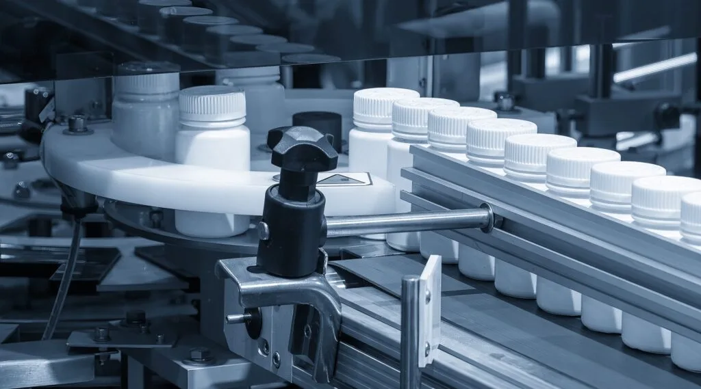 Medicine bottle filling process in the light blue scene.